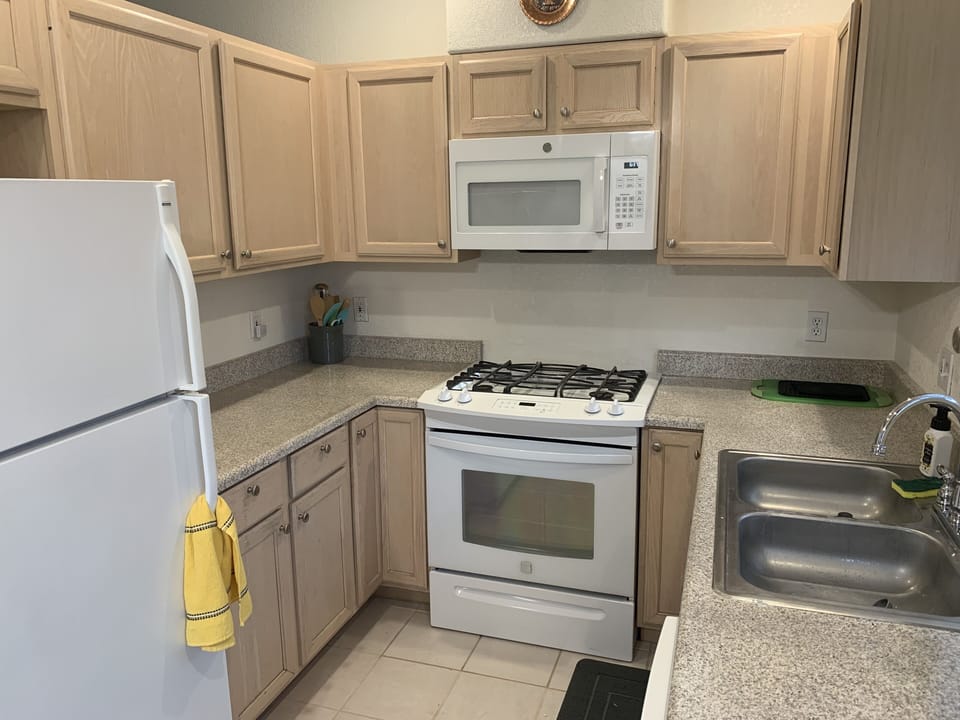 Full kitchen with dishes and cooking utensils
