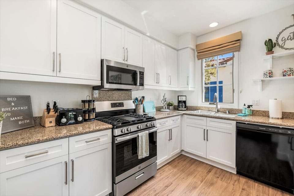 The kitchen is truly a chef`s delight! Stainless steal Kitchenaid convection oven with 5 burner gas stovetop, including griddle!
