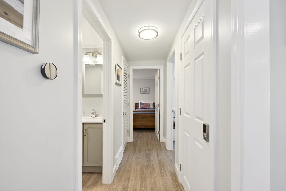 Bathroom on left, twin bedroom, master bedroom.