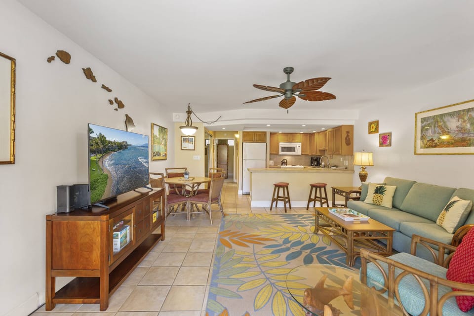 Large living room with flat screen television and queen sized sofa sleeper