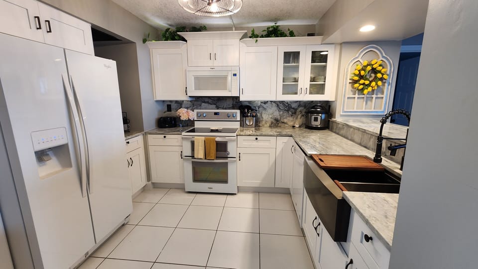 Brand new stocked kitchen with drip style coffee maker