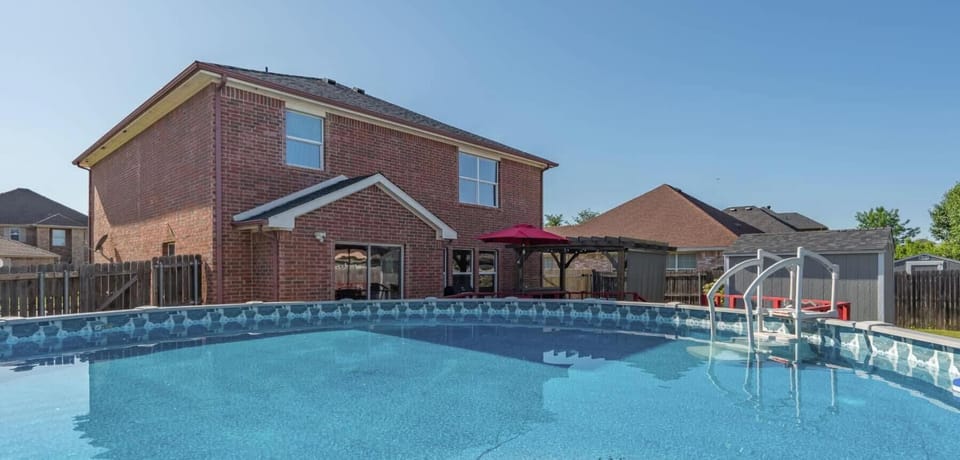 Escape to a relaxing retreat featuring a private above-ground pool, a cozy patio, and a spacious backyard; ideal for families and groups. Experience comfort, convenience, and easy access to top local attractions for a memorable stay!