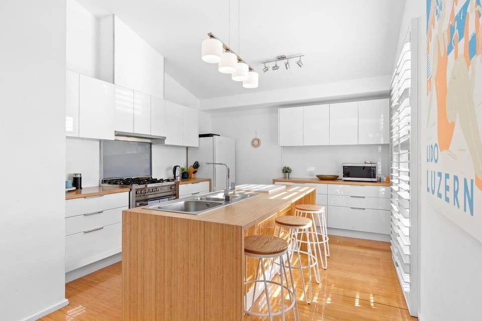 Modern well-appointed kitchen with quality appliances and a Nespresso pod machine.
