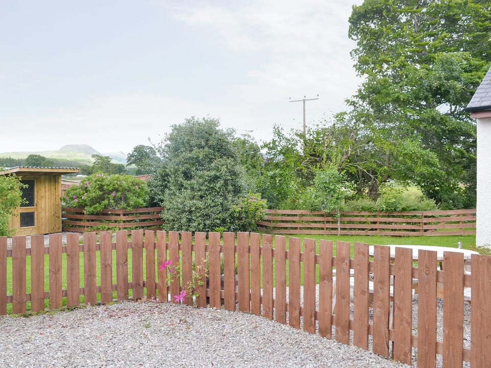 Parking area and view over garden | North Lodge Gate House, Muir of Ord