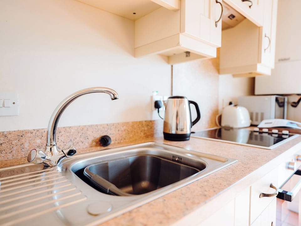 Kitchen area | Goose Cottage - Celtic Haven Resort, Lydstep, near Tenby
