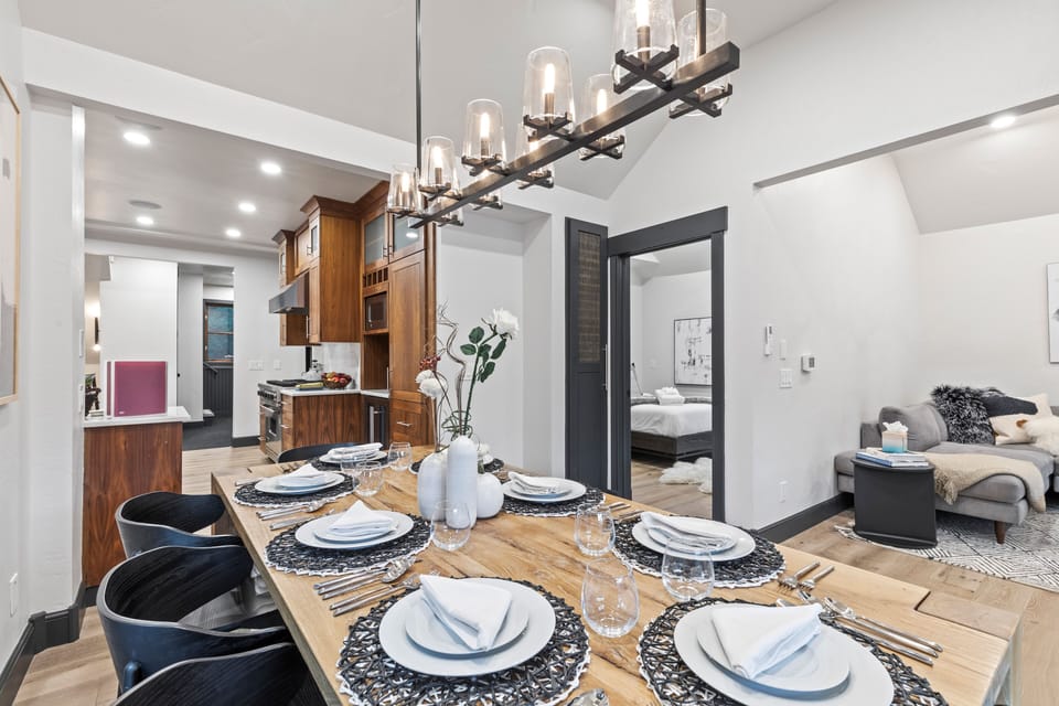 Gather for meals in this bright dining area with vaulted ceilings, seating for eight, and seamless access to the well-appointed kitchen. A stylish and comfortable gathering spot.