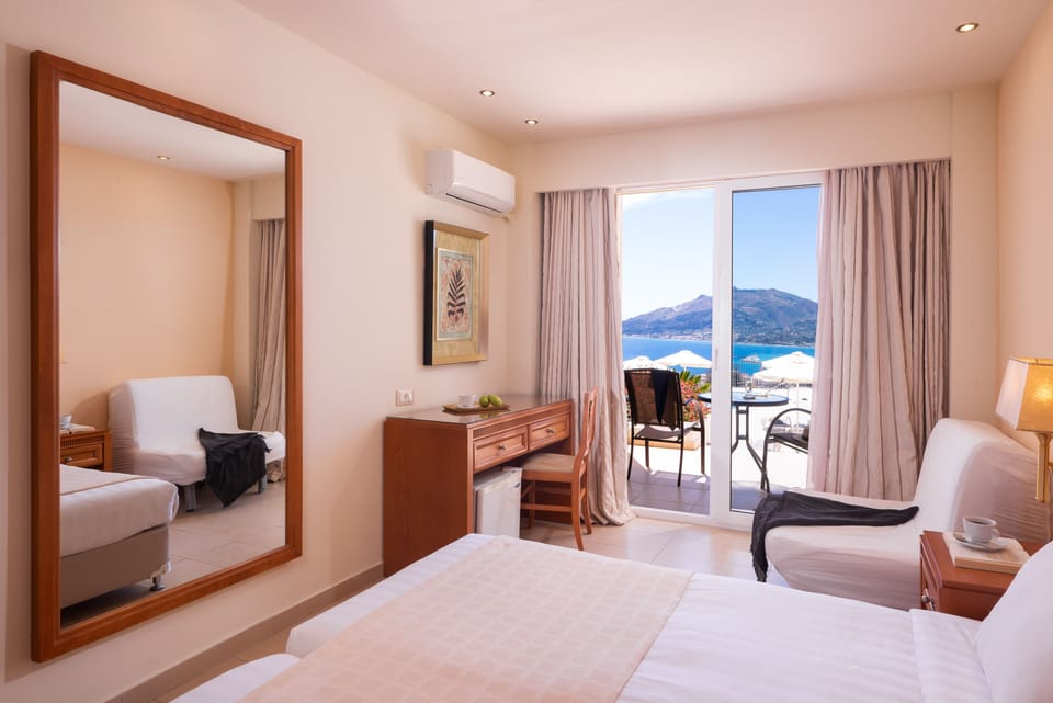 Poolfront Double Room with Sea View | Pillowtop beds, in-room safe, desk, blackout drapes