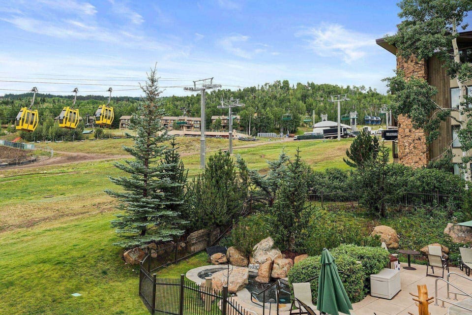 The view from the living, dining and patio areas is off the Fanny Hill ski trail and Thursday night concert stage.