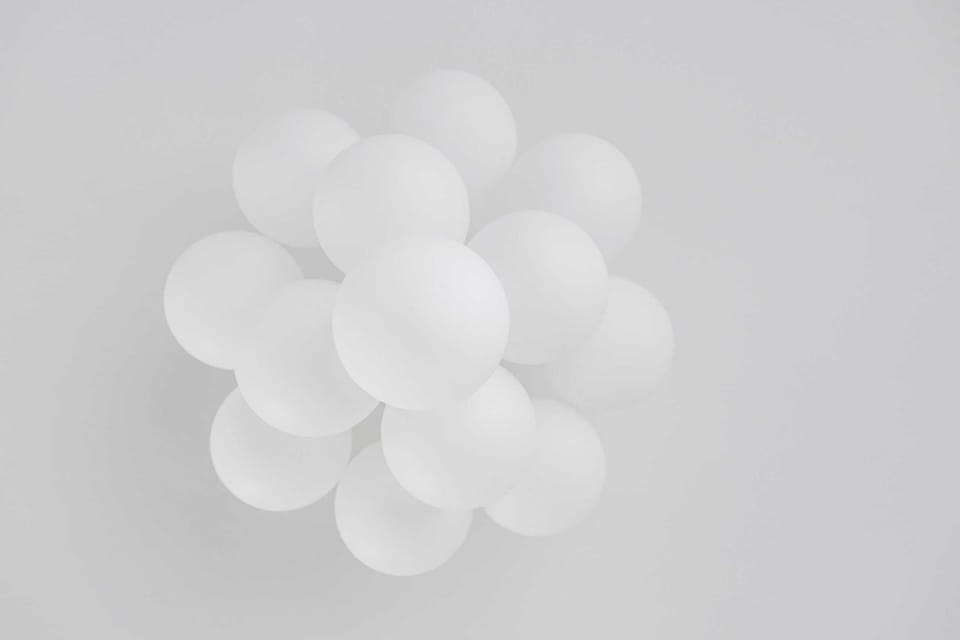 A close-up of modern wall art resembling floating balloons, adding an artistic touch to the space.