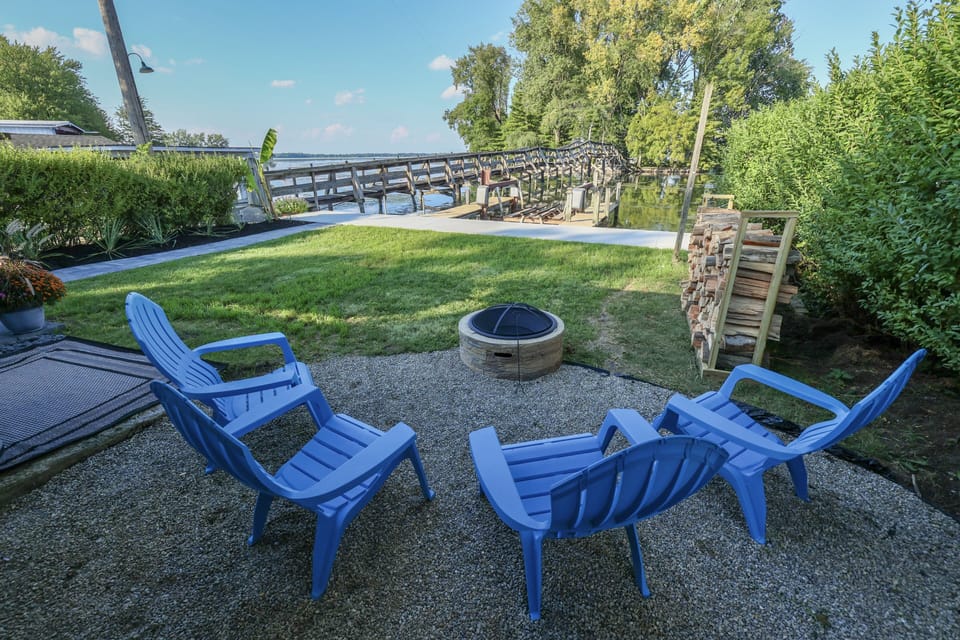 Outdoor patio with fire pit overlooking your private dock and the lake.