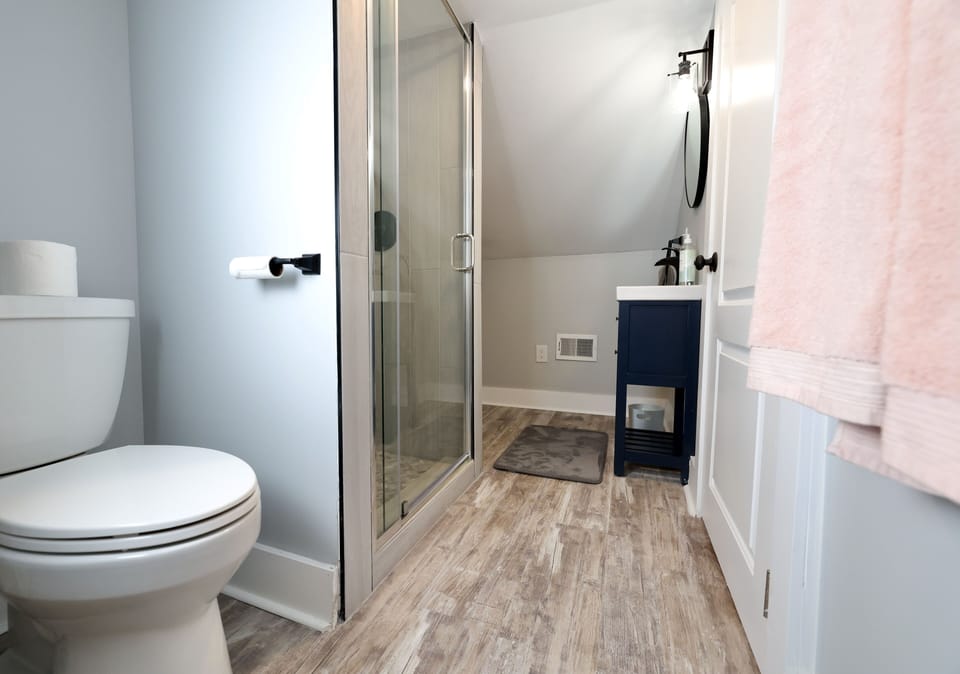 Upstairs bathroom also has a shower and two sinks.