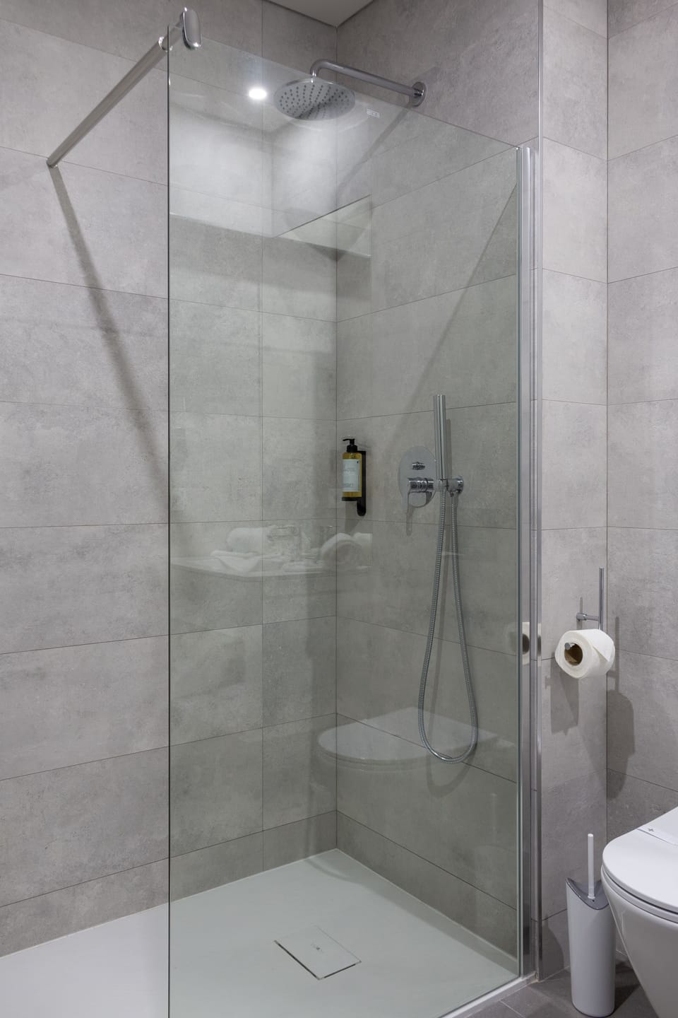 Shower, rainfall showerhead, hair dryer, towels