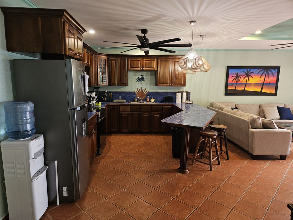 Side view of kitchen.  5 gallon jugs of water are supplied