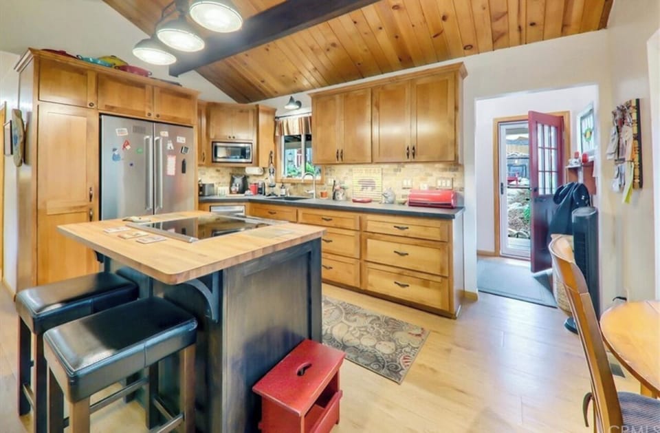 Island has a digital even-induction stove top w/Pots and pans too