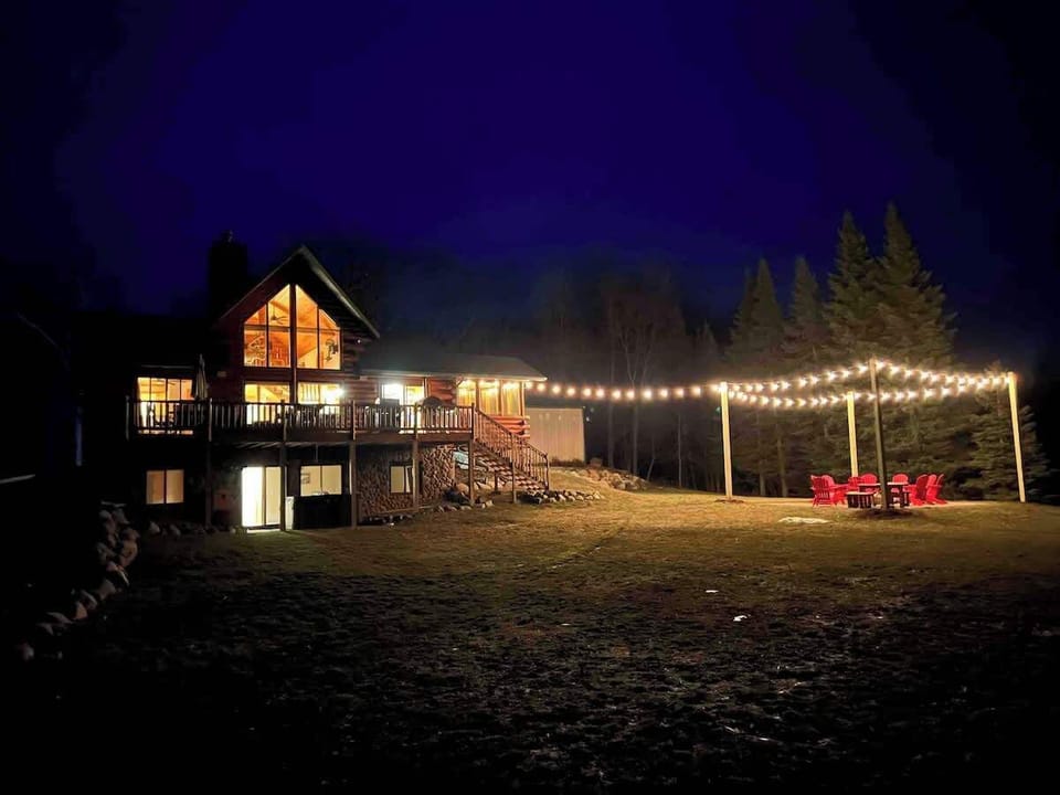 Cafe lights around fire pit creates an amazing ambiance for gatherings!