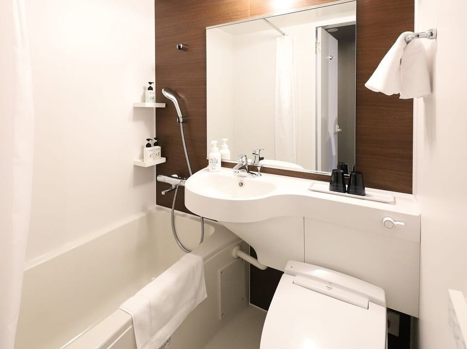 Combined shower/tub, free toiletries, hair dryer, bathrobes