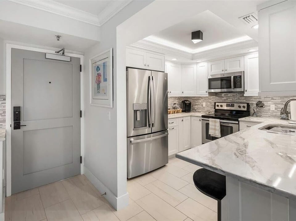 White and Bright Kitchen with Stainless and Quartz