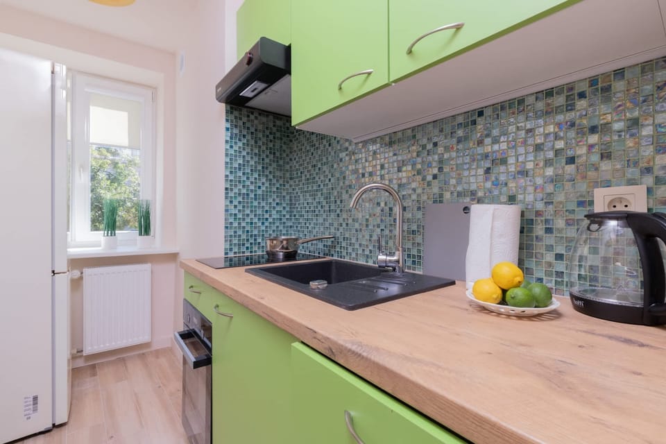 Kitchen with oven and refrigerator. 
