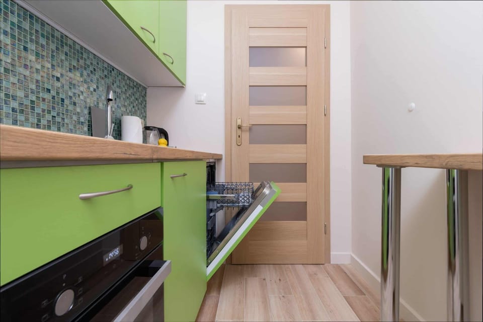 Kitchen with oven and refrigerator. 