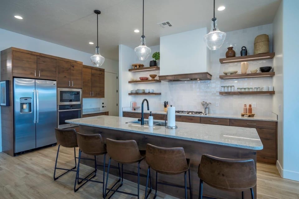 Kitchen is stocked with plenty of appliances and utensils for cooking