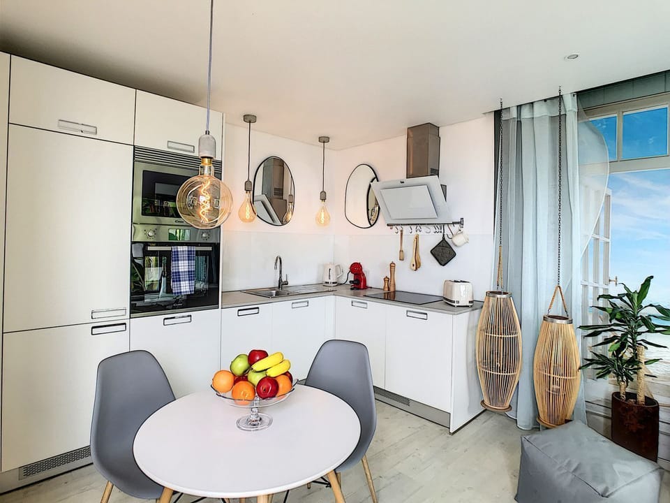 Compact yet inviting kitchen, offering all the comforts of home in a cozy Funchal setting. #lovelydecor #coffeemachine