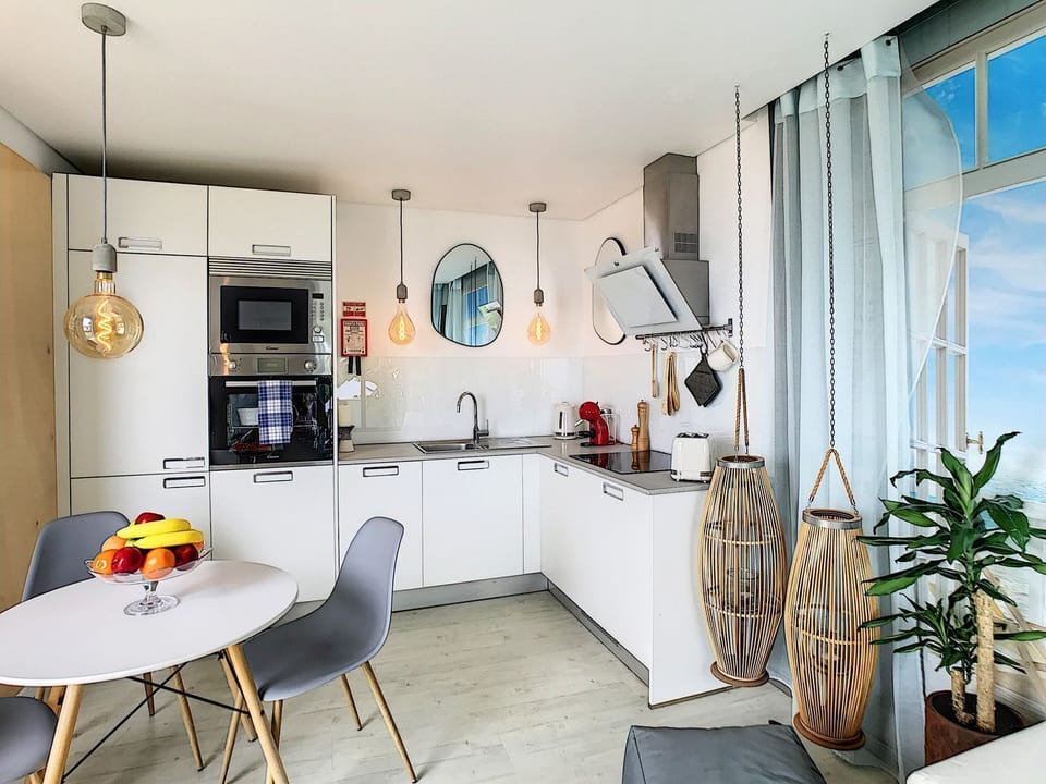 Take a different view of the small but cozy kitchen, revealing its delightful details from a fresh perspective. #coffeemachine