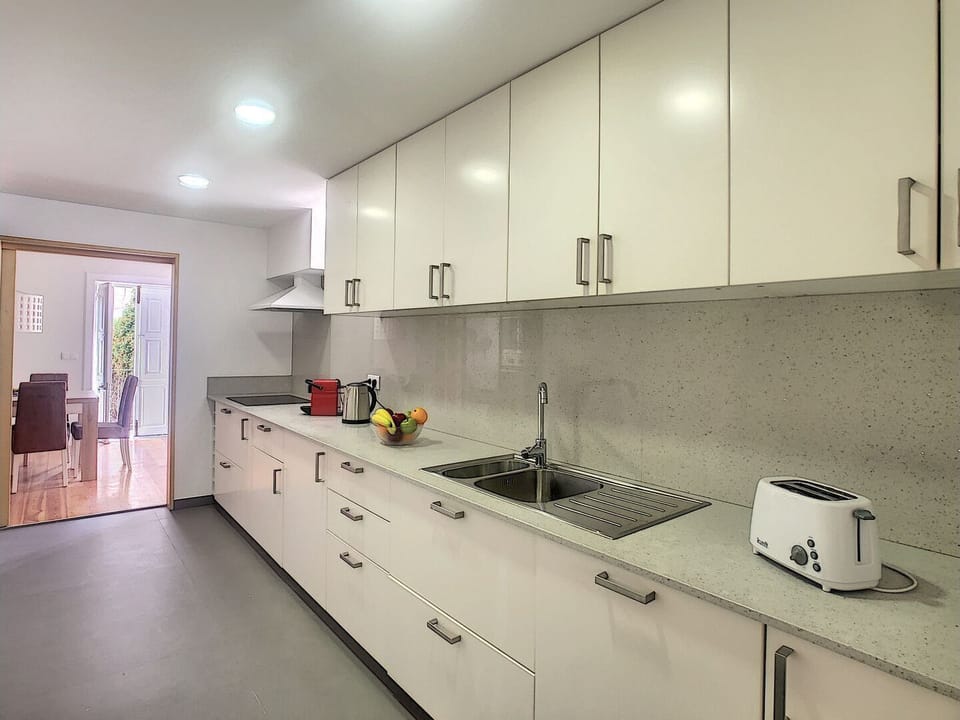 Sleek and functional modern kitchen for culinary enthusiasts #nespresso #toaster #modern