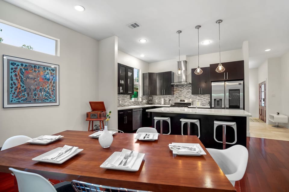 Kitchen with Bosch appliances and Samsung Smart Fridge, overlook dining area.