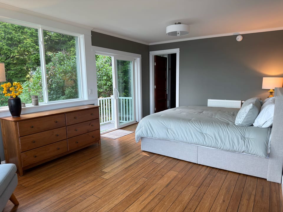 Ground-floor Primary King Suite with direct outdoor deck access