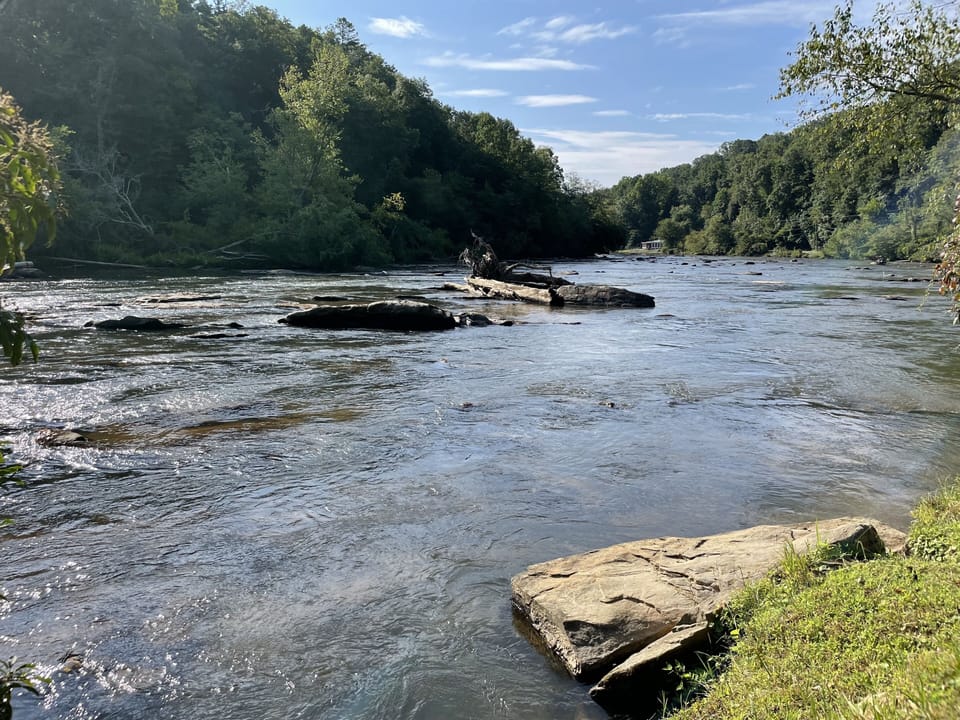 River in front of cabin.