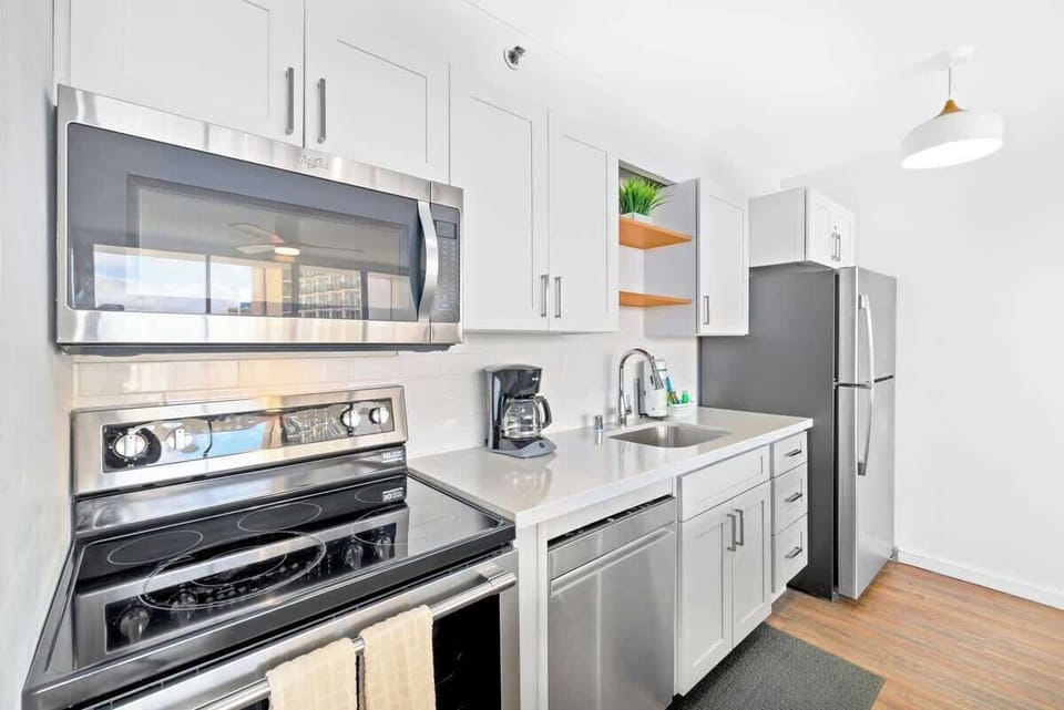 Updated kitchen with all-new appliances including stove, oven, microwave, refrigerator, and dishwasher