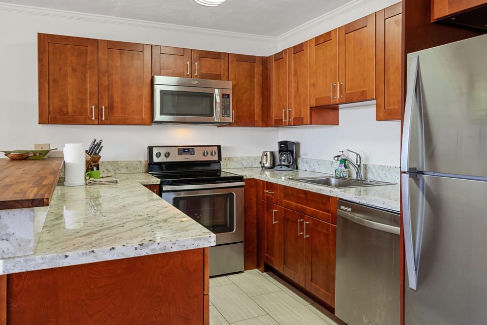 Spacious kitchen equipped with stainless steel appliances and everything you need to dine in.