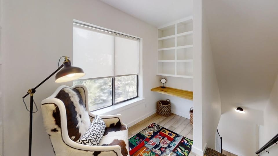 You'll find your own quiet corner to unwind—a cozy reading nook with built-in bench, soft natural light, and open shelving ready for your favorite books.