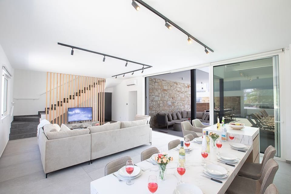 Ground Floor surrounded by large patio doors leading to the garden