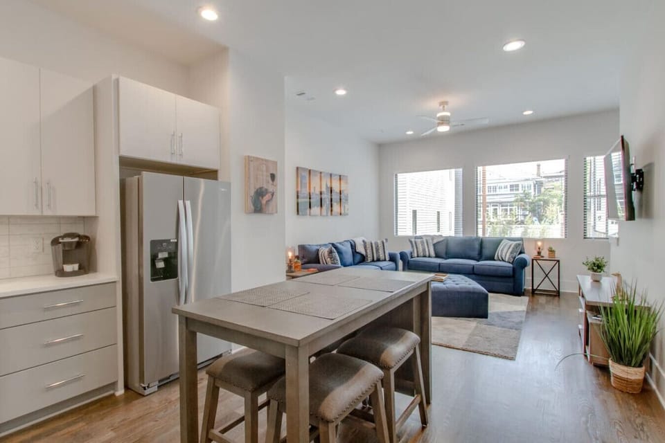 The open kitchen flows right into the dining and living areas for easy gatherings.