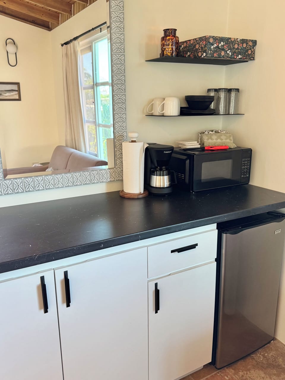 Mini fridge, coffee maker, microwave, smart tv, and AC. 