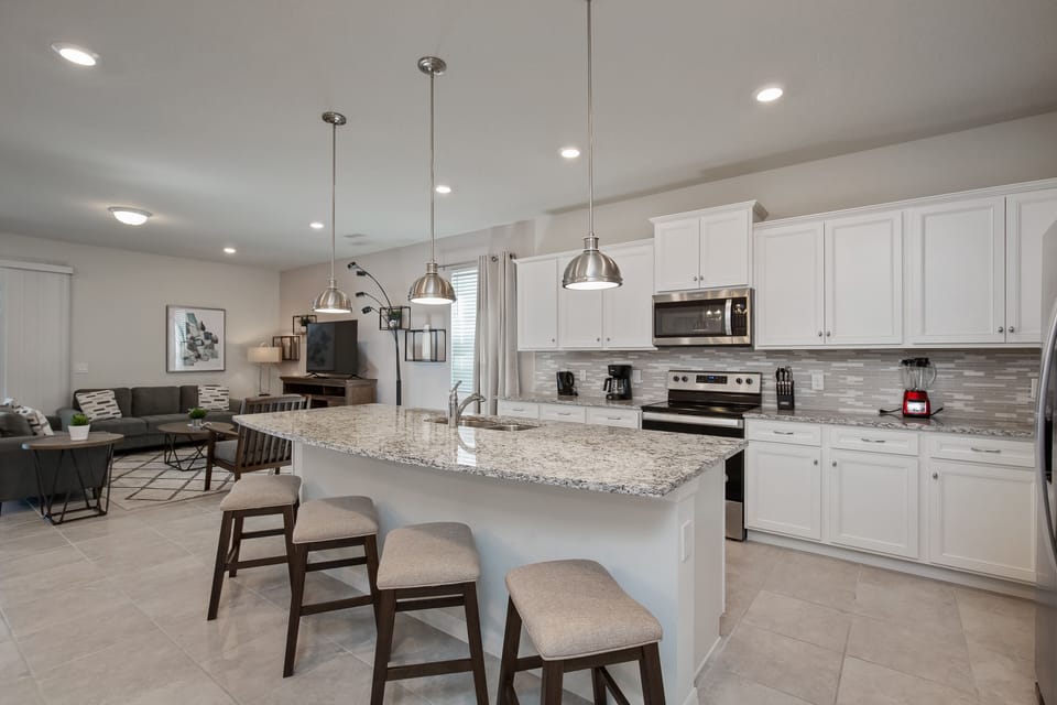 Beautiful view of large kitchen island and living room