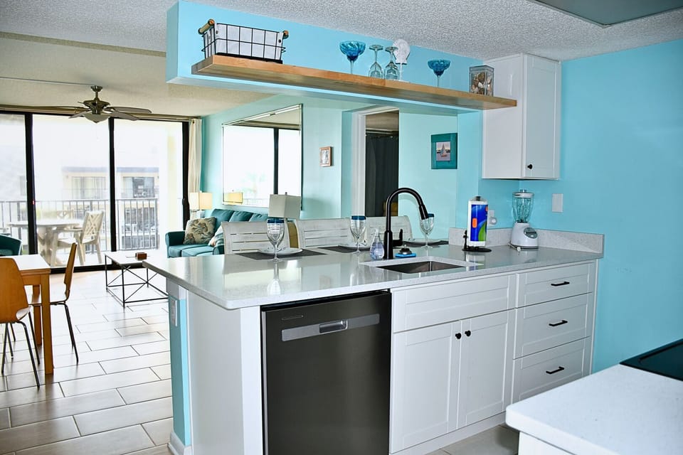 Modern kitchen with sleek appliances and a fresh coastal vibe