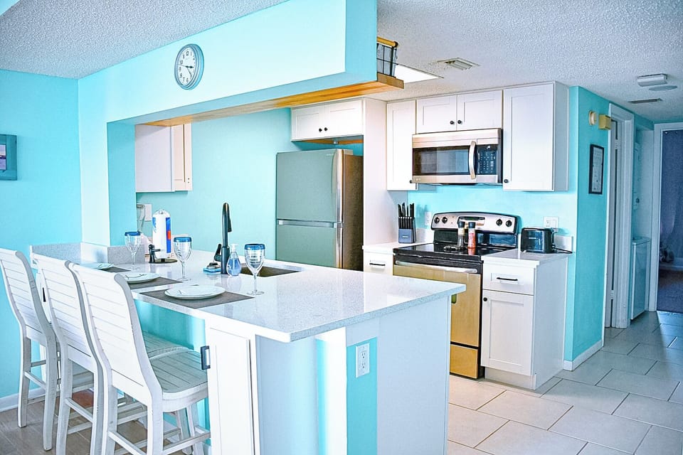 Fully equipped kitchen with modern appliances and ample counter space