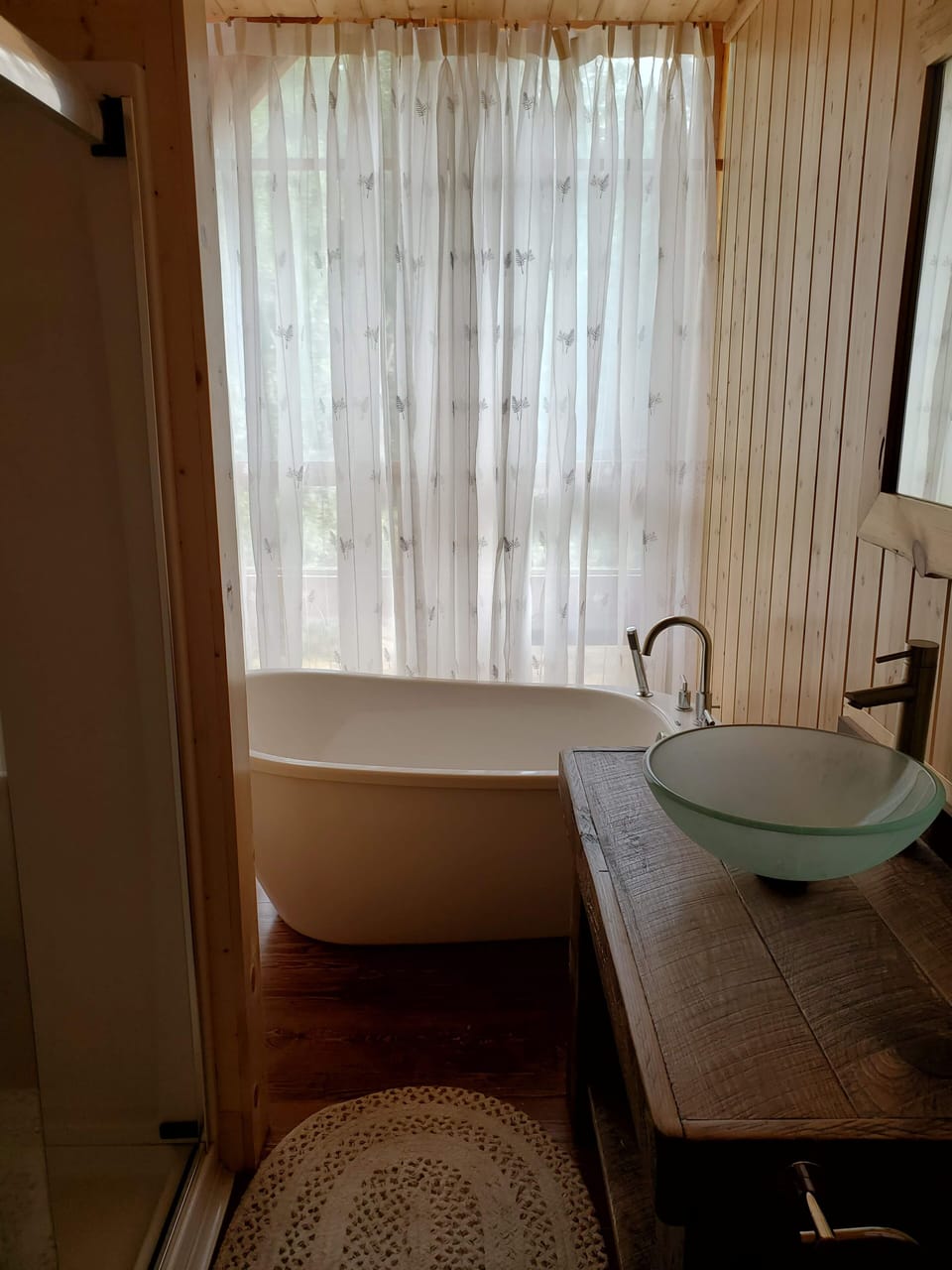 Main floor bathroom with shower and tub