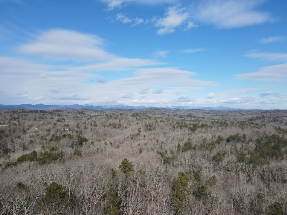 Birds eye view of Mountains in the distance during the winter. 