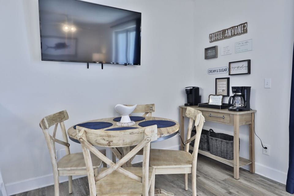 Coffee bar pictured behind the dining table.