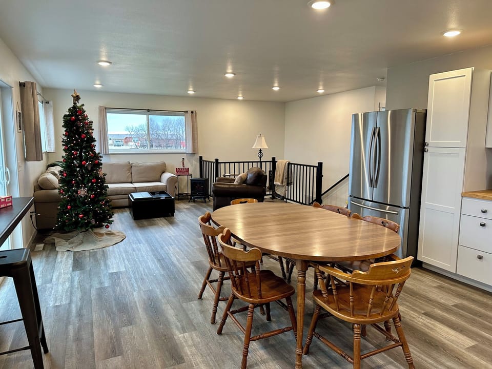 Central dining table is perfect for meals, card games, puzzles and long chats.