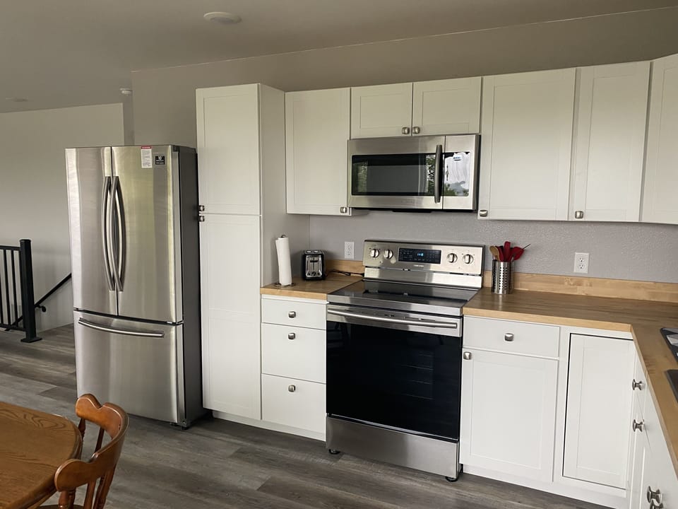 HUGE fridge and very nice range and microwave. Plenty of cookware and utensils