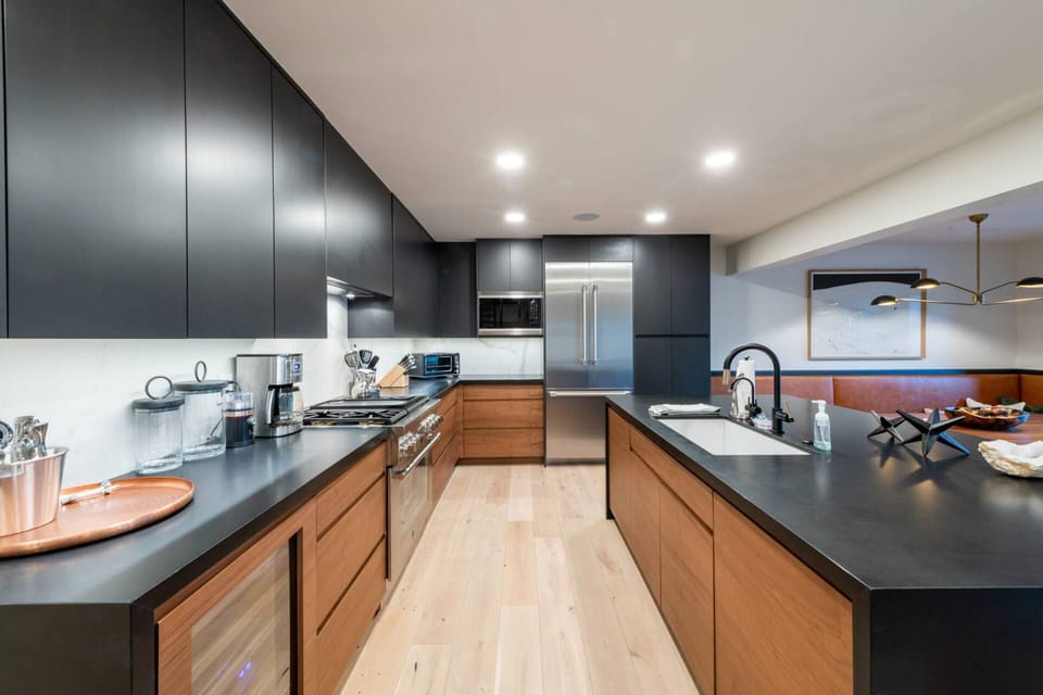 Kitchen is Very well equipped with brand new Thermador appliances, including professional gas stove and wine fridge for your après-ski convenience, an