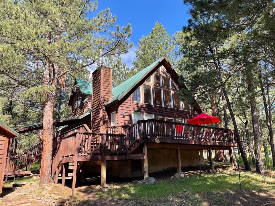 House showing one of two staircases to access deck. 