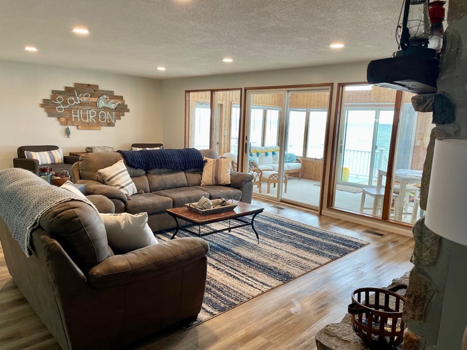 Large family room with attached sunroom.