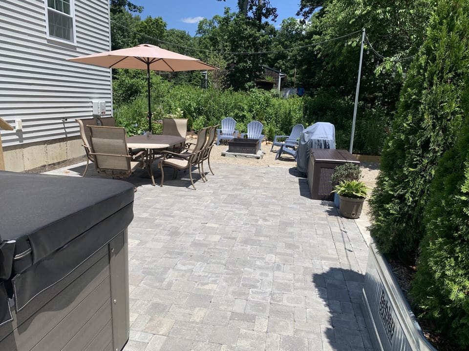 Rear Patio with Dinning area, Weber Grill, and new 6 person Hot Tub.