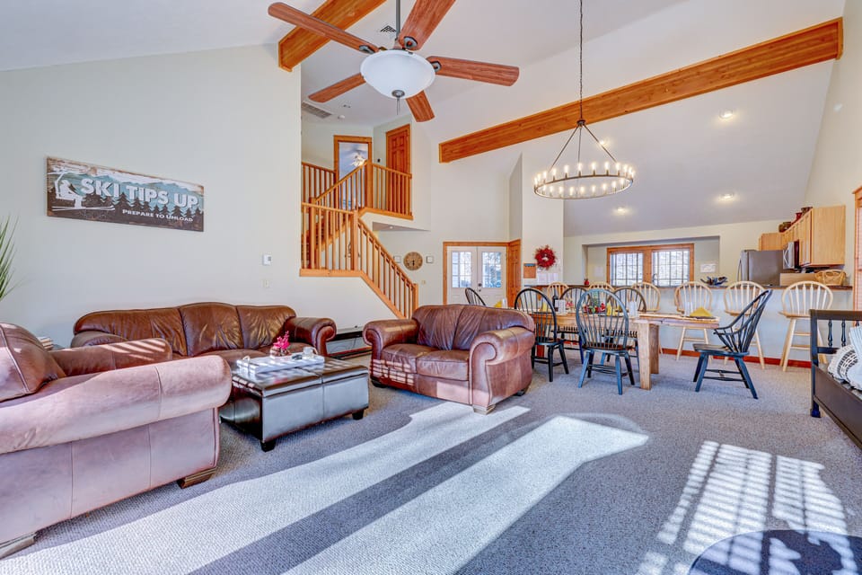 Full view of the living room, dining area, and kitchen.