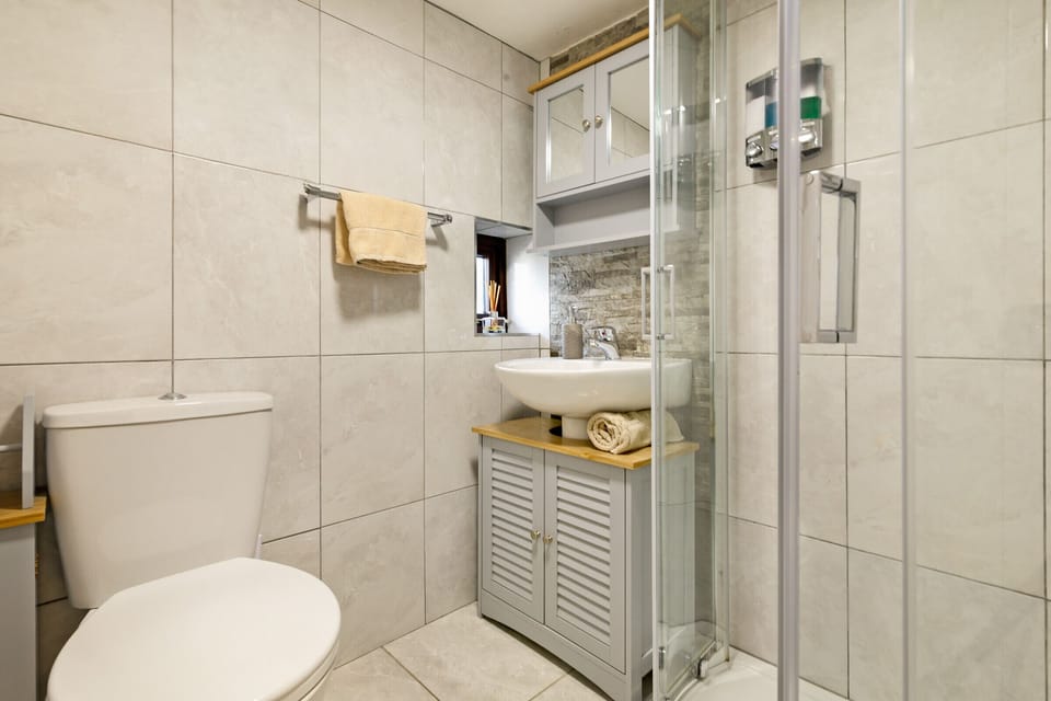 Another full bathroom can be found on the ground floor.